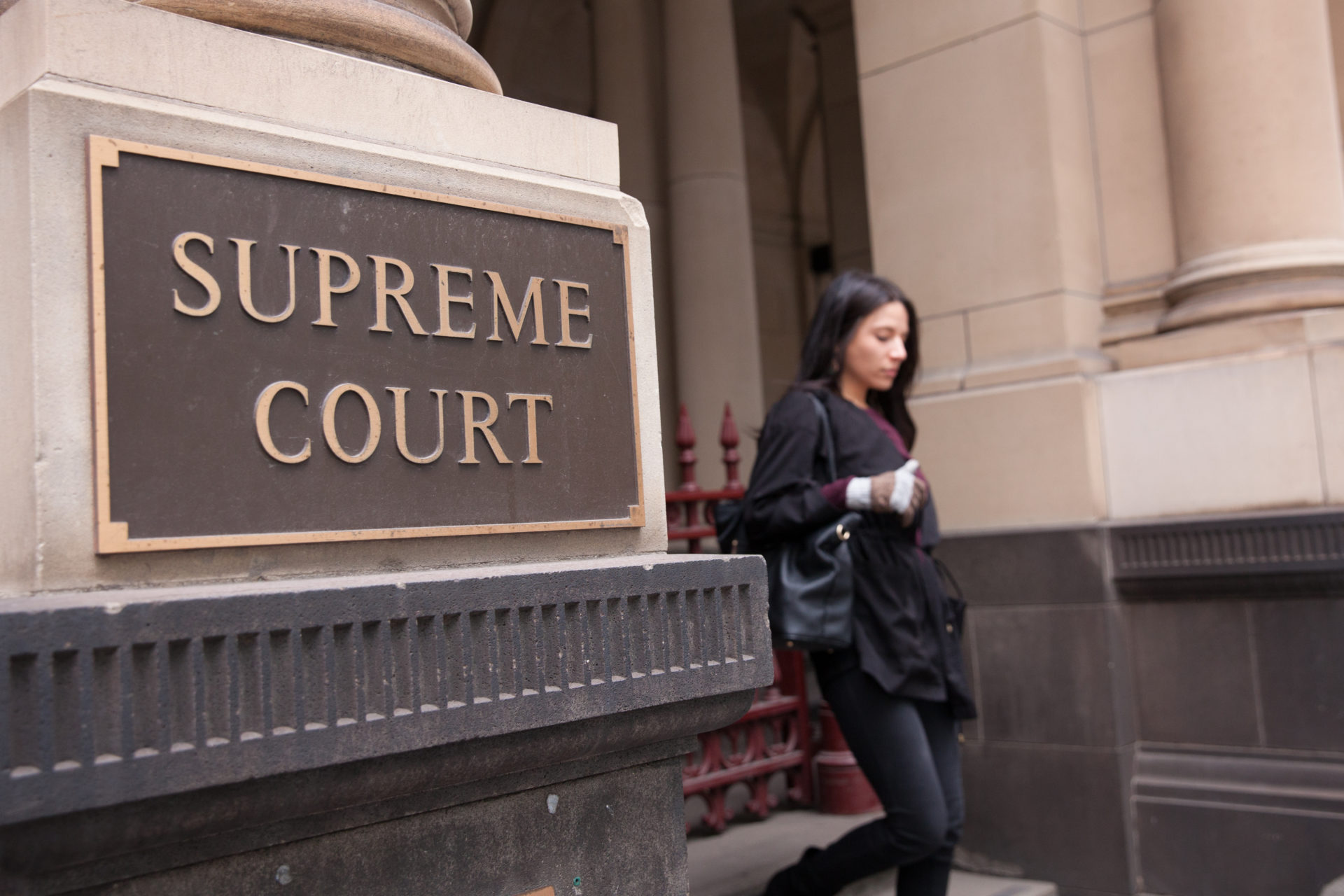 Woman leaving Supreme Court