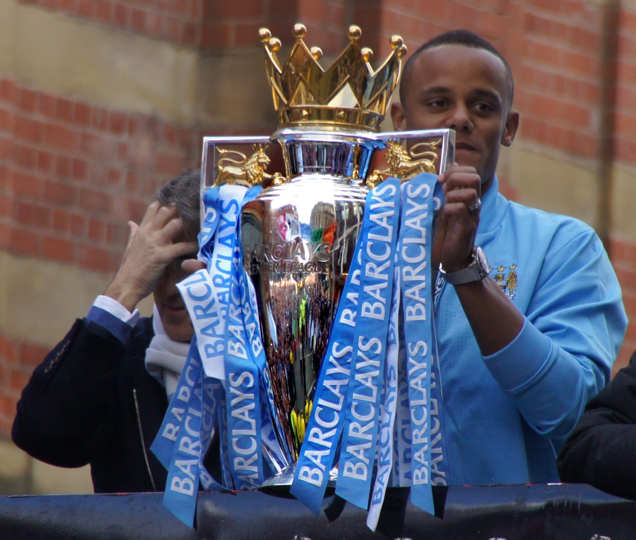 Manchester City captain Vincent Kompany with 2012 Premier League trophy