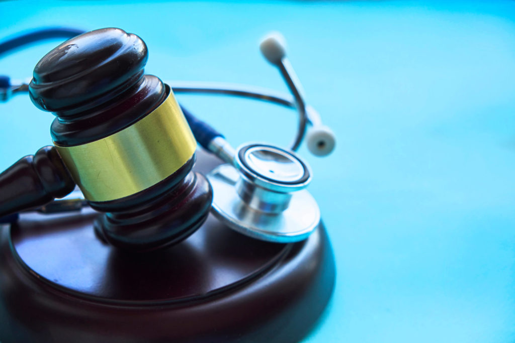 Gavel and stethoscope. medical jurisprudence. legal definition of medical malpractice. attorney. common errors doctors, nurses and hospitals make.